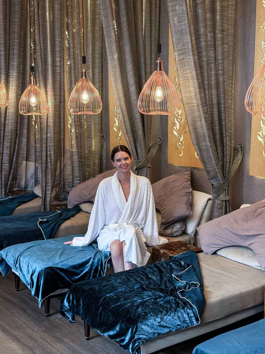 Amy in robe on lounger in Boringdon Hall Spa relax room